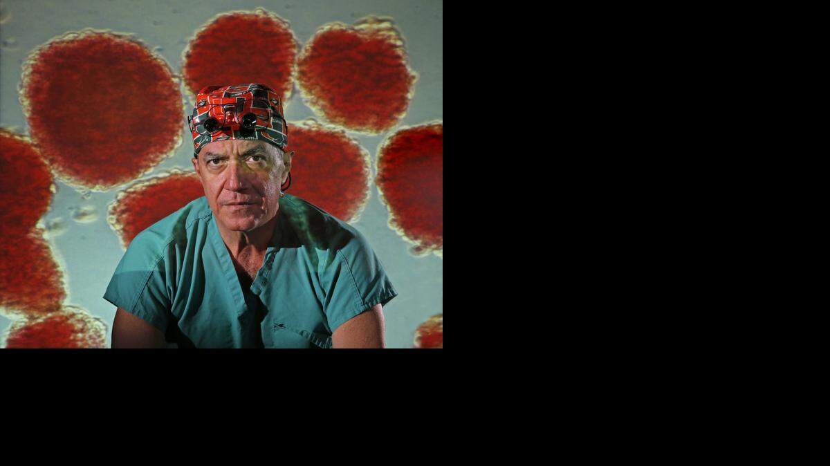 
AT DIABETES RESEARCH INSITUTE: Dr. Camillo Ricordi with islets (cell clusters in the pancreas that produce insulin) projected behind.  Some patients who’ve had islet cell transplants don’t have to take insulin.



