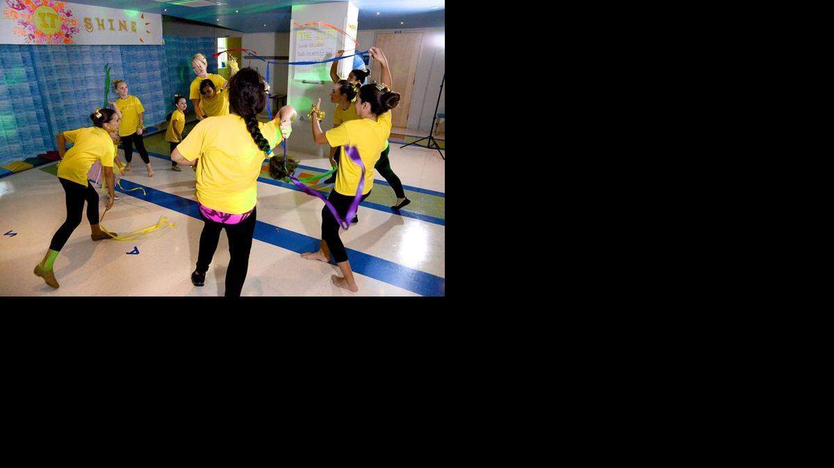 
CIRCLE GAME: Children in occupational therapist Sarah Brockway’s Dance/Movement Class at Miami Children’s Hospital Doral Outpatient Center learn from the theater- and dance-trained Brockway (center) moves that benefit children with sensory, social, motor planning, coordination and speech/language difficulties.
