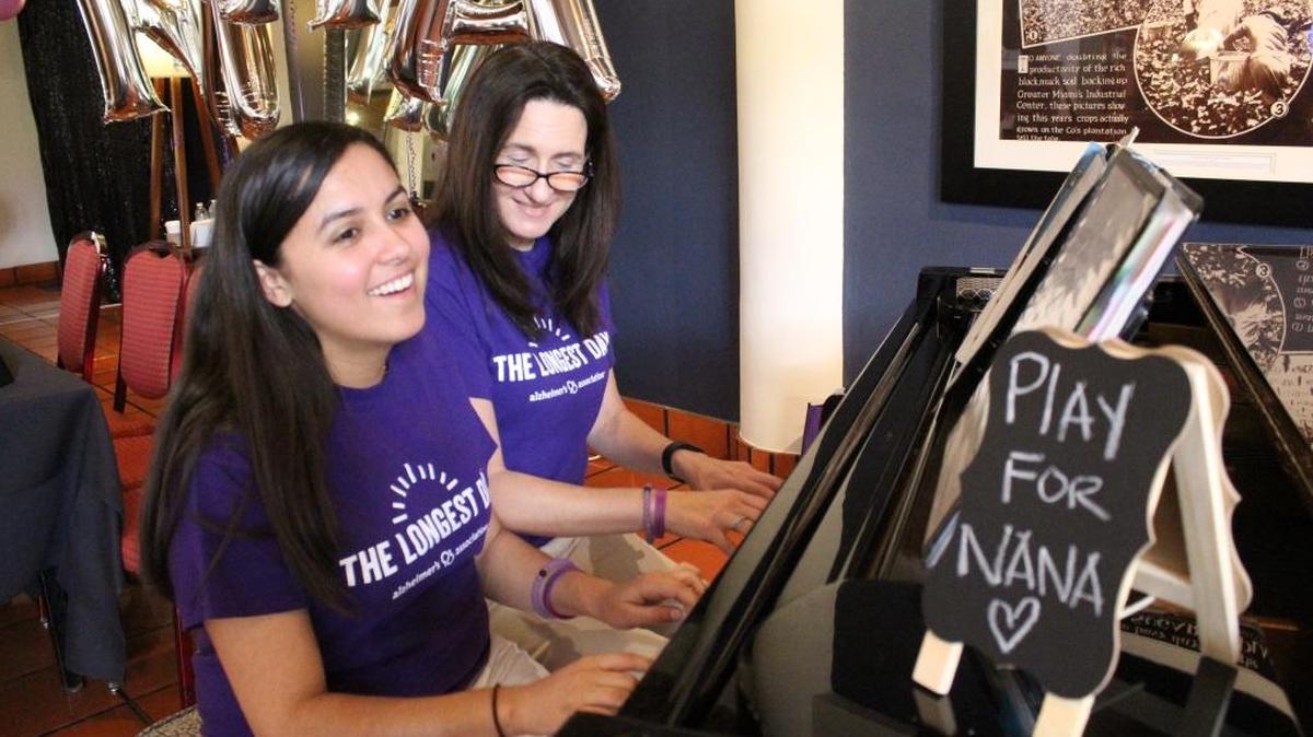 Jessica Comellas plays a duet with her mother, María Comellas, during a piano-thon held May 14 at Don Shula’s Hotel to honor Ileana Merino, Jessica’s grandmother and María’s mother.