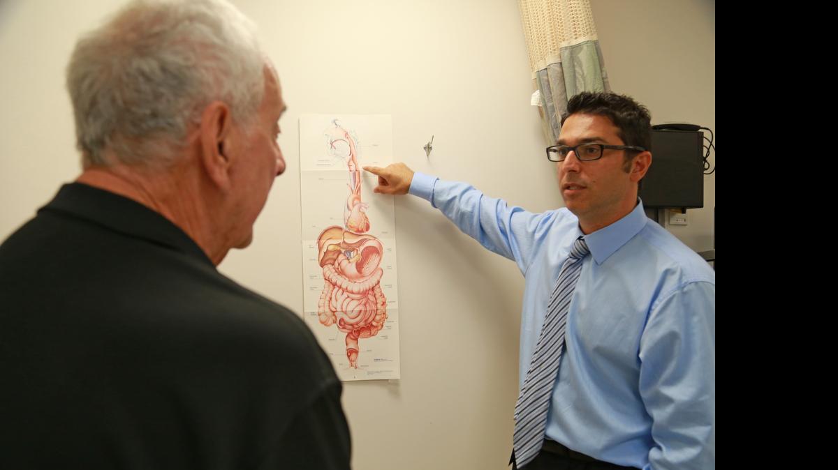 REFLUX SIGNS:  Dr. Kfir Ben-David, talking to patient Raymond Stravato at Mount Sinai Medical Center in Miami Beach,  says that 80 percent to 90 percent of esophageal cancer patients have had acid reflux.