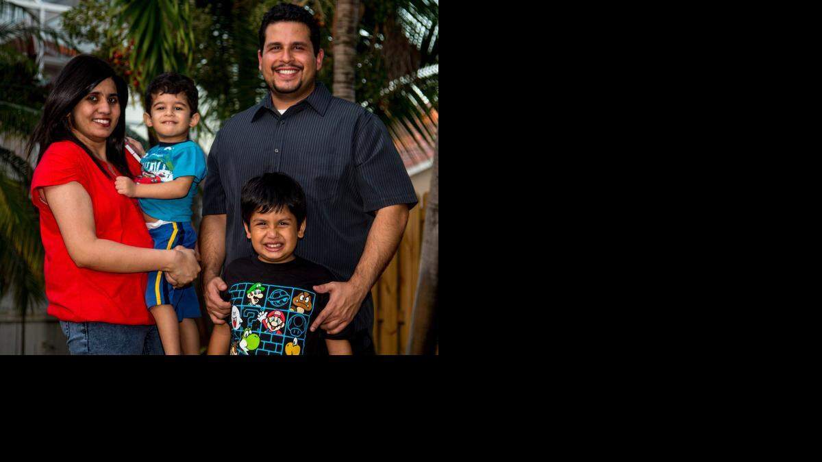 
SUPPORTIVE FAMILY: Sujato Santiago, left, with her husband Joshua and sons Raj, 2, and Aaron, 6, was 34 when she was diagnosed with breast cancer earlier this year. 
