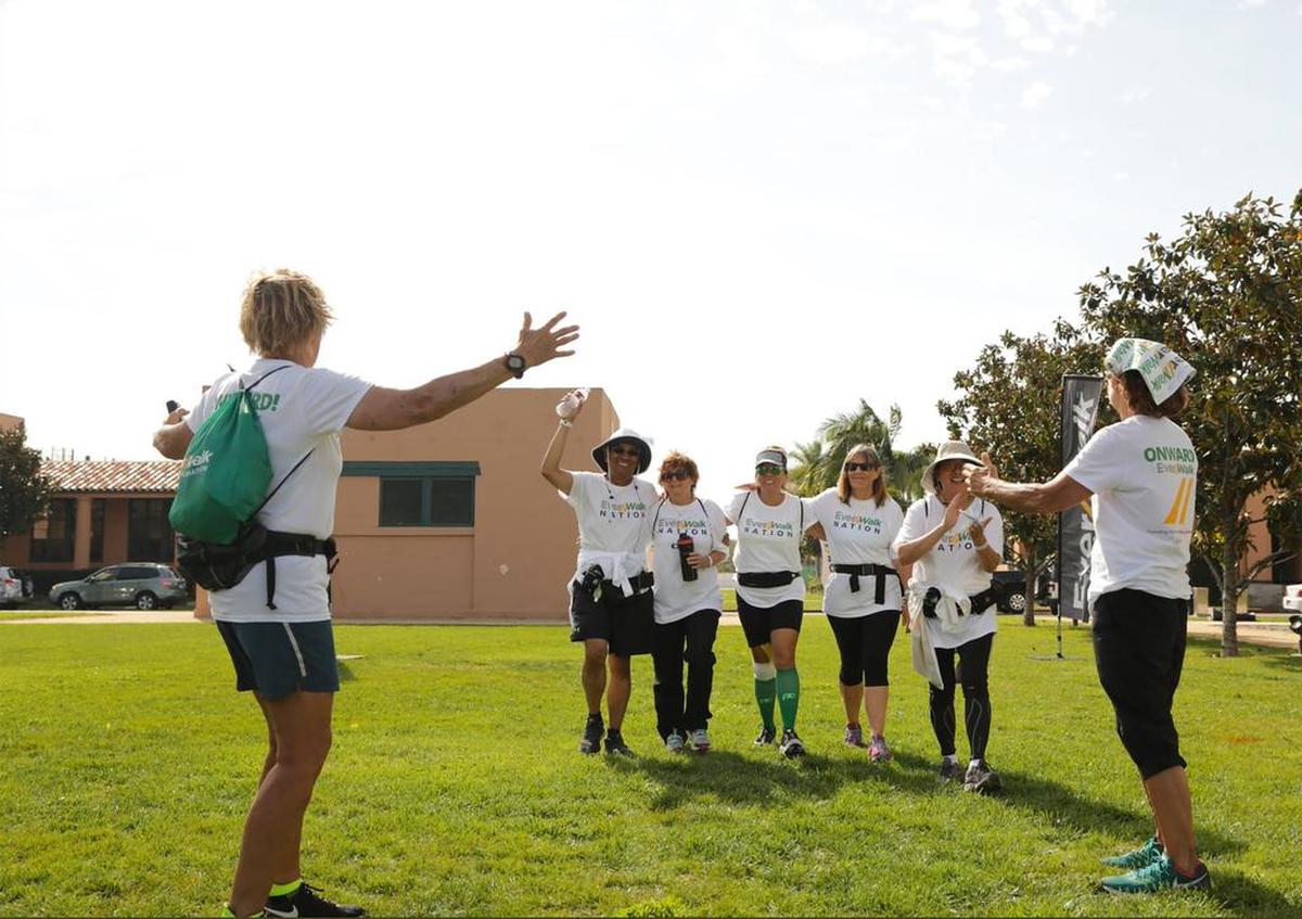 Diana Nyad, left and below, and Bonnie Stoll, right, welcome walkers returning from a walk with EverWalk, which aims to get Americans across the country walking.