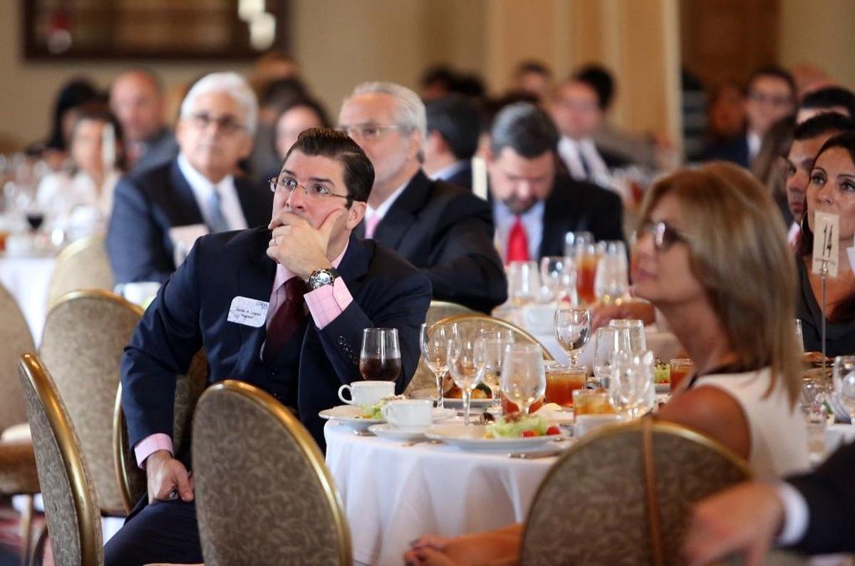 Cuban American Bar Association president, Javier Lopez, listens to Brian Cuban, a Dallas attorney and brother of Mark Cuban, talk about his journey with addiction, eating disorders, depression and suicide attempts.