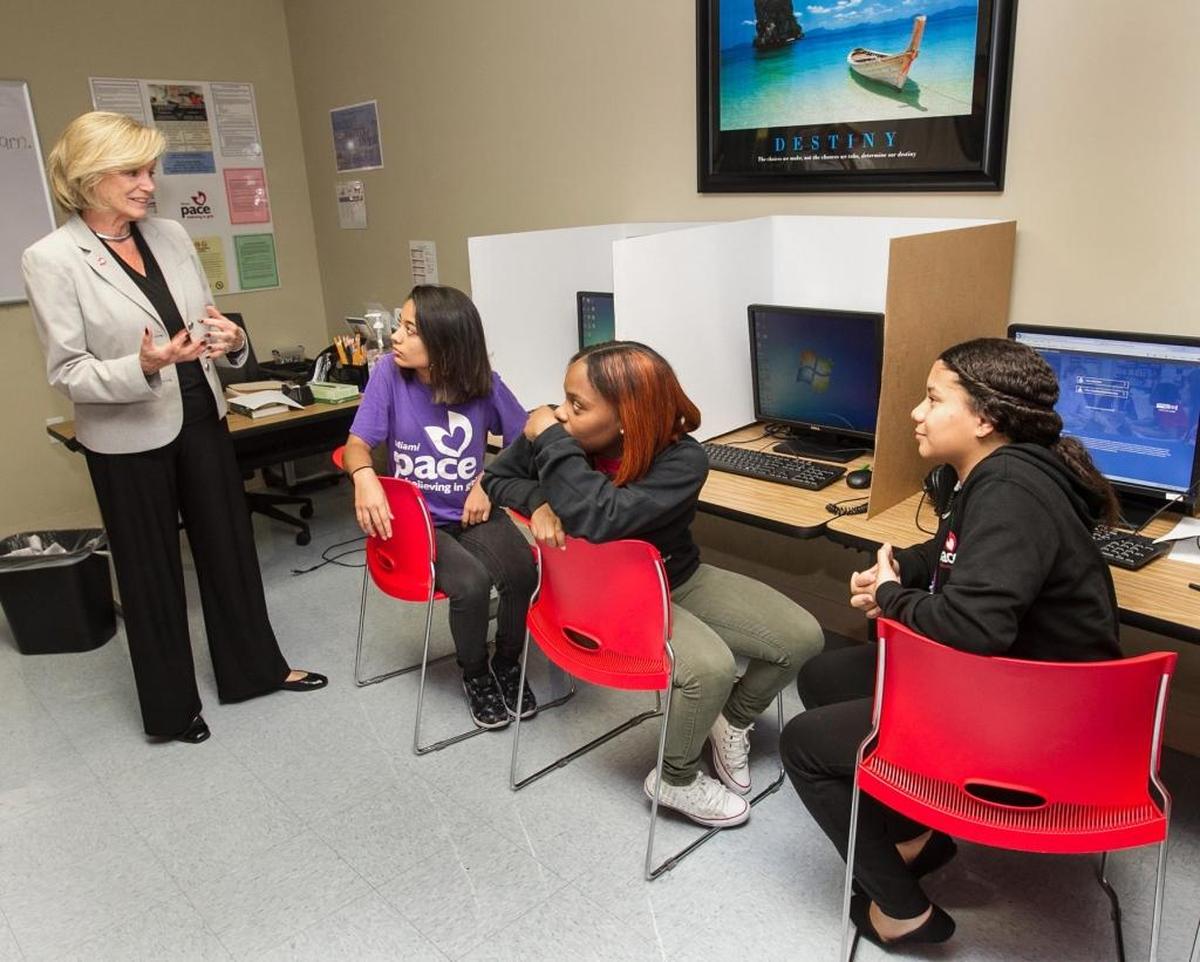 Sherry Thompson Giordano, executive director of PACE MIAMI Center for Girls, speaks with Jennifer,12th grade, Tylashia, 11th grade, and Mabelin, 11th grade, in the Computer Room on Monday, November 6, 2017