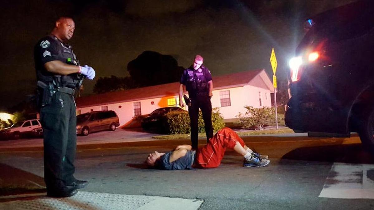A man convulses in the street from a heroin overdose two blocks away from the Delray Beach police station on Nov. 18.