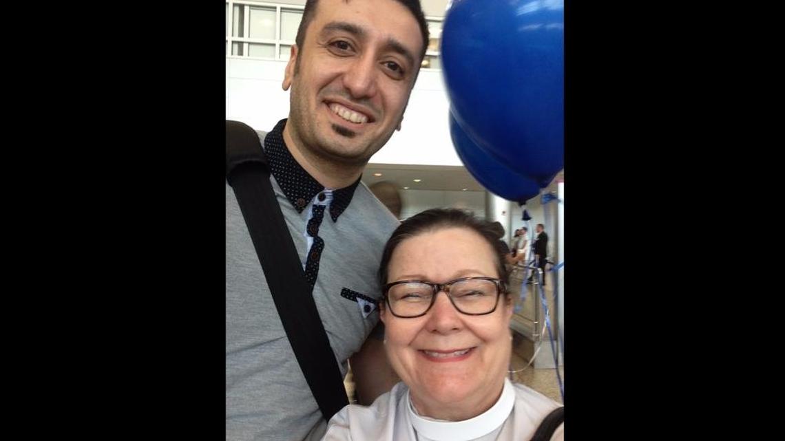 Nima Masoumi with the Rev. Wilifred Allen-Faiella, the rector at St. Stephen’s Episcopal Church in Coconut Grove, who welcomed him at Miami International Airport after he arrived from Iran on Feb. 4, 2016. St. Stephen’s has helped him to resettle in South Florida.