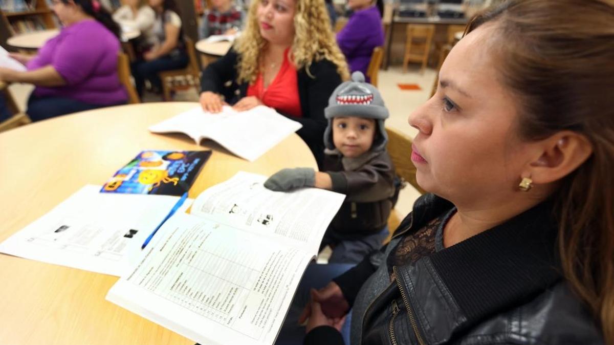 Left to right, Hilsia Noemi Hernandez, Gabriel Quijada,3, and his mother Gladys Orellana, during an Amigos for Kids parenting session to help parents learn how to become better parents, held at Shenandoah Elementary on Thursday, October 26, 2017.