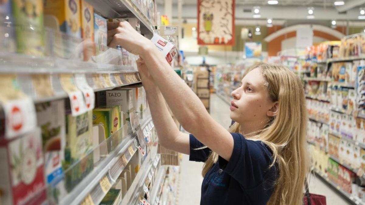 Dylan Heller, 12, buys groceries for the Jewish Community Services Kosher Food Bank with money she received for her birthday at Publix Super Market at Biscayne Commons near North Miami.