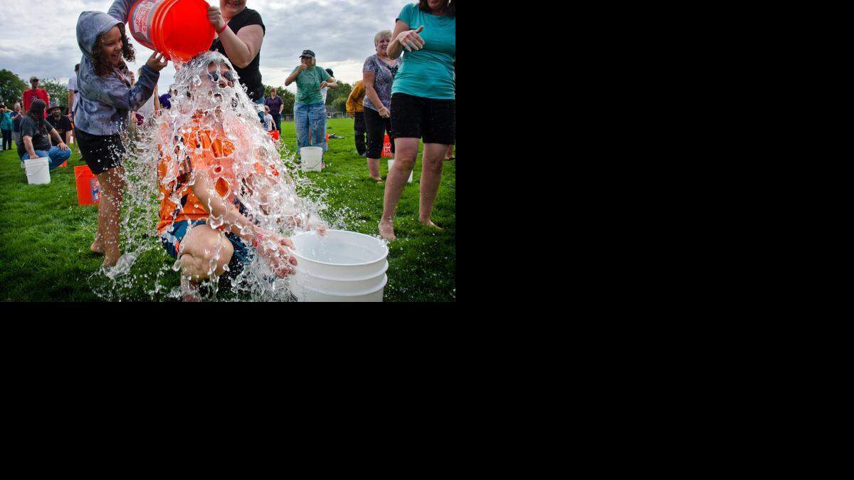 
dousing for dollars: Chas McKhann gets an ice-water splash during an ice bucket challenge in September at Walla Walla, Wash.


