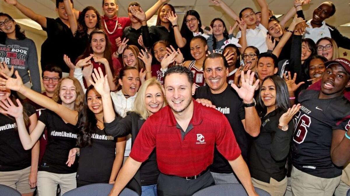 Brian Garcia with his parents Maria and Carlos Fiallo, and volunteer students at Pembroke Pines Charter High School, October 20, 2016. When his brother Kevin died, Brian Garcia, an 11th grade history teacher at Pembroke Pines Charter High School, started with his family the Keven Garcia Foundation. He has set up a club at the school, which works on three main events a year - the Christmas toy drive with Joe DiMaggio Children's Hospital, the Thanksgiving food drive through Centro Mater in Hialeah and an Easter luncheon at Joe DiMaggio.