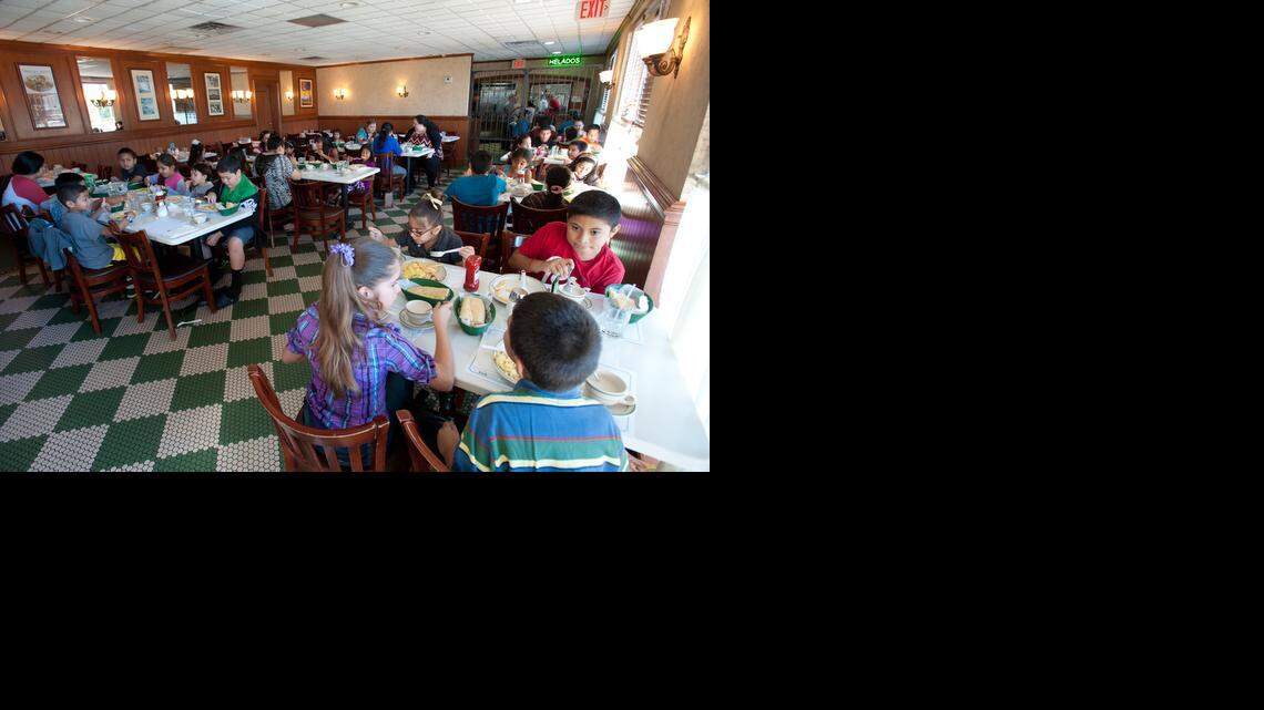 
Kids attend Cafecito Entre Padres, or coffee among parents, breakfast at Versailles restaurant on Saturday, Oct. 25, 2014. 
