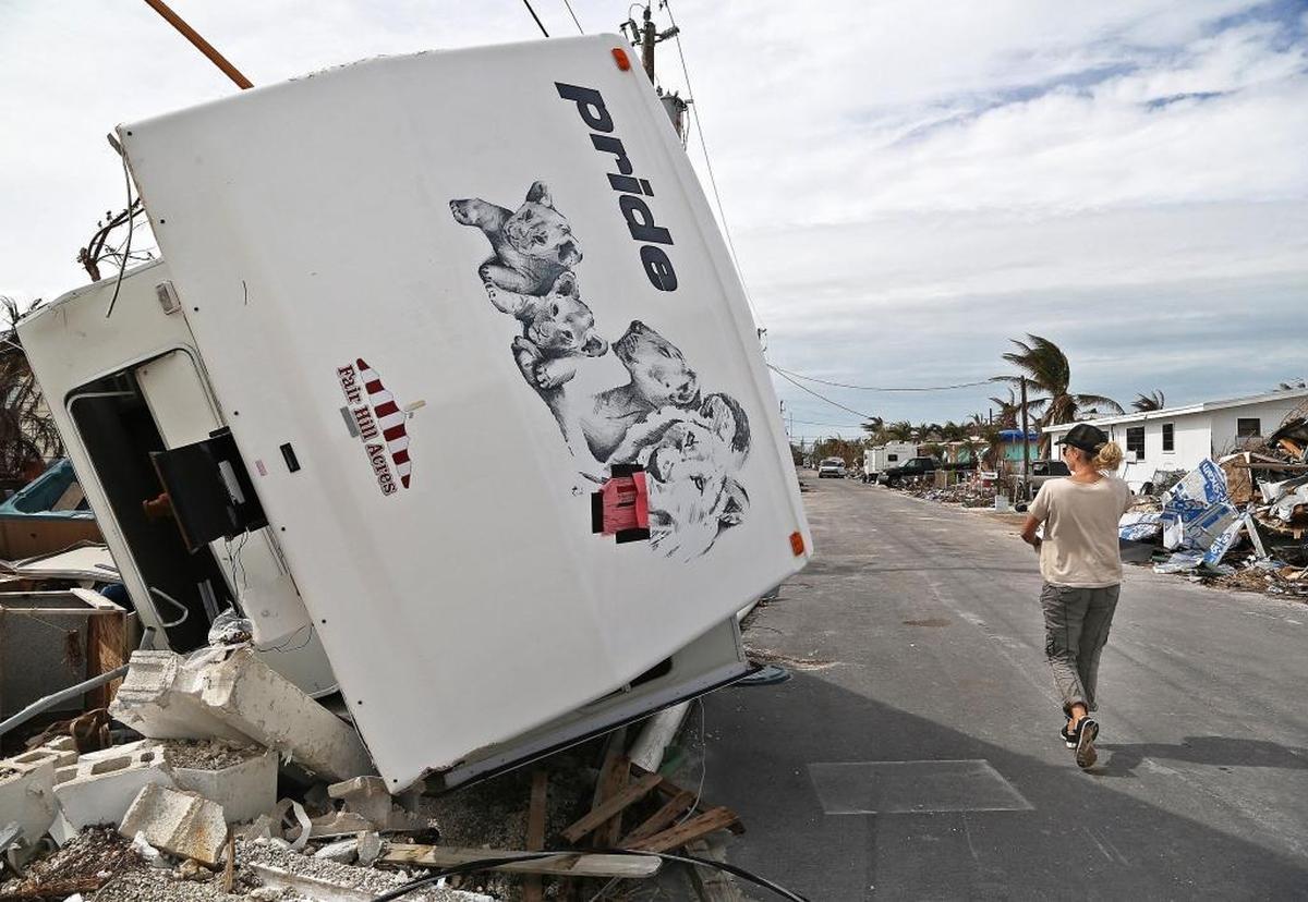 Volunteer Margit Bisztray delivers food to residents in the storm- ravaged area of Big Pine Key in the Florida Keys on Oct. 25, 2017.