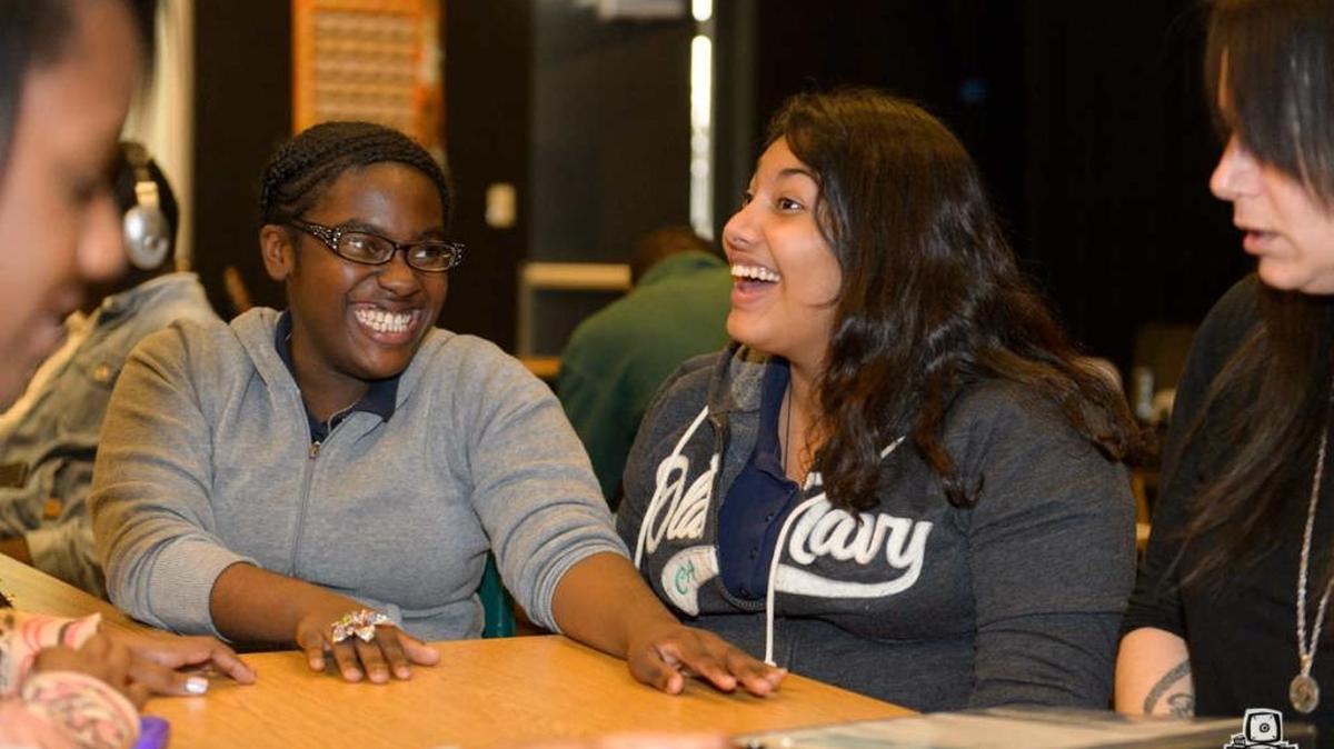 Vocalists Rachelle Gabriel, left, and Britney Arroyo, right, no longer attend North Miami Middle School, but they still attend Guitars Over Guns sessions at the school with mentor Michelle Forman, far right.Session was in January 2015.