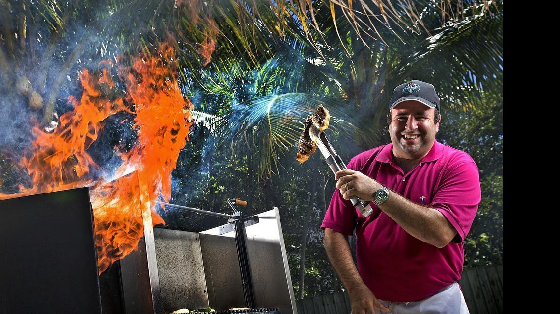 Feel the rush: Chef Danny Serfer mans his impressive backyard barbecue grill on Tuesday.