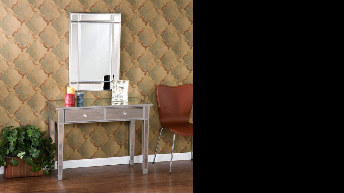
Mirrors make rooms appear larger, so consider the Mirage mirrored two-drawer console table ($230) at Home Depot an optical illusion.
