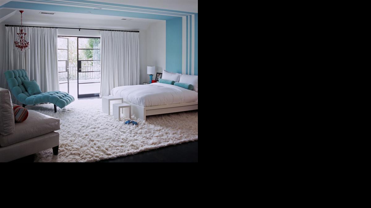 
Betsy Burnham designed filled this bedroom for a preteen girl in white with a few accessories in the girl’s current favorite color. The room can easily (and affordably) take on a new look if her taste in colors changes.
