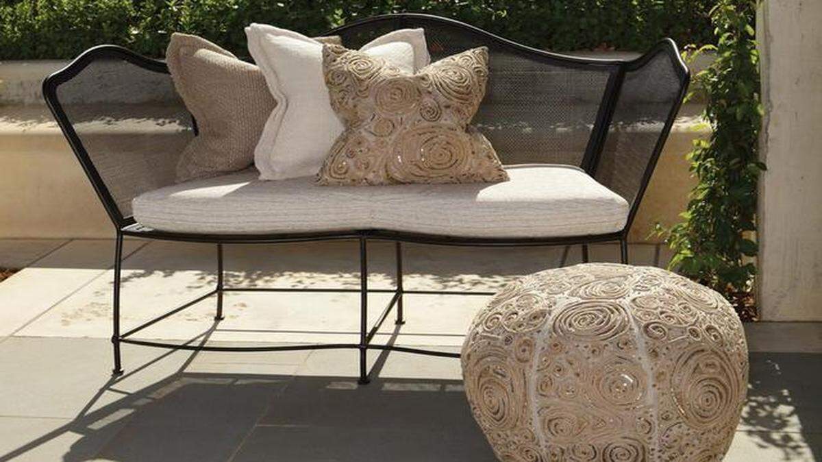 
The curvaceous lines and delicate features of the iron Eiffel Loveseat are inspired by a vintage French design. 
