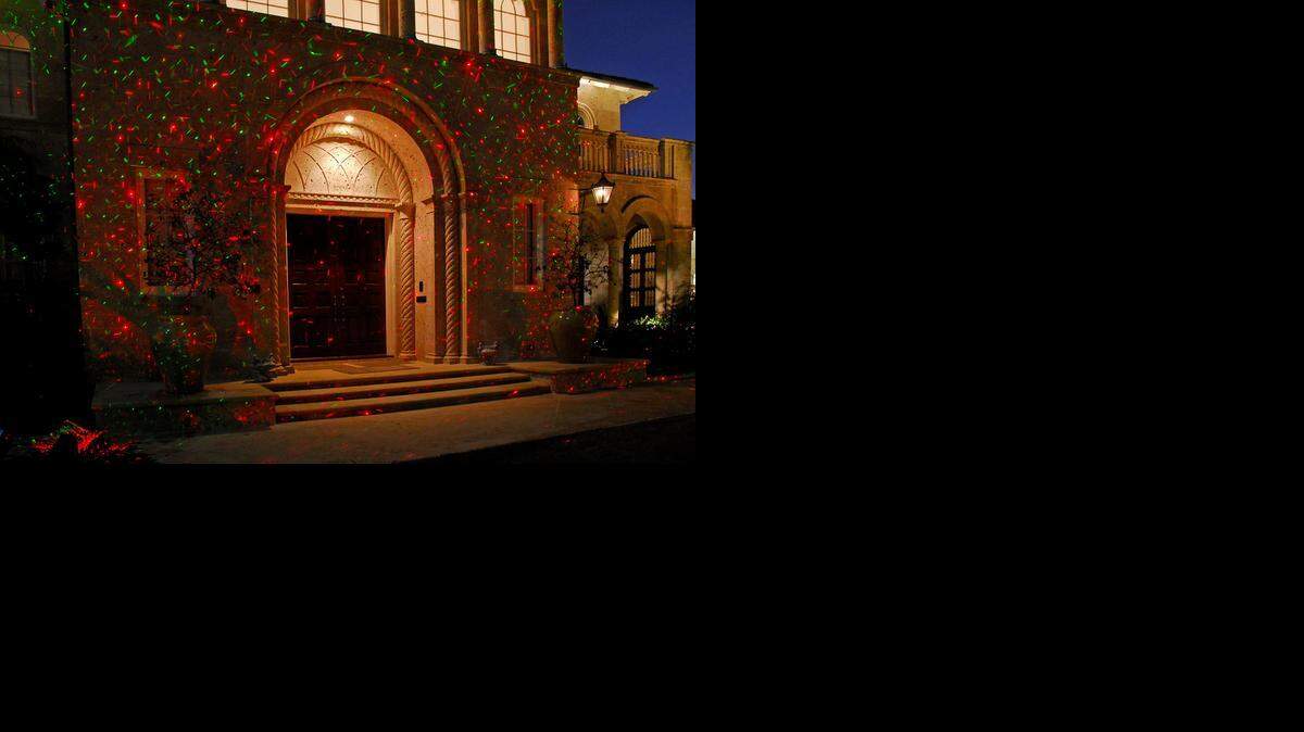 
Using small spotlights, the technology shown in this photo projects thousands of tiny pinpoints of red, green or red and green lights onto your home or any other hard surface. 
