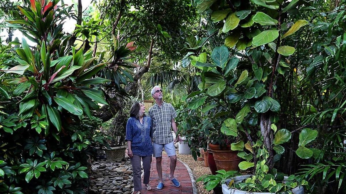 Mark and Elizabeth Worsdale walk in their garden.