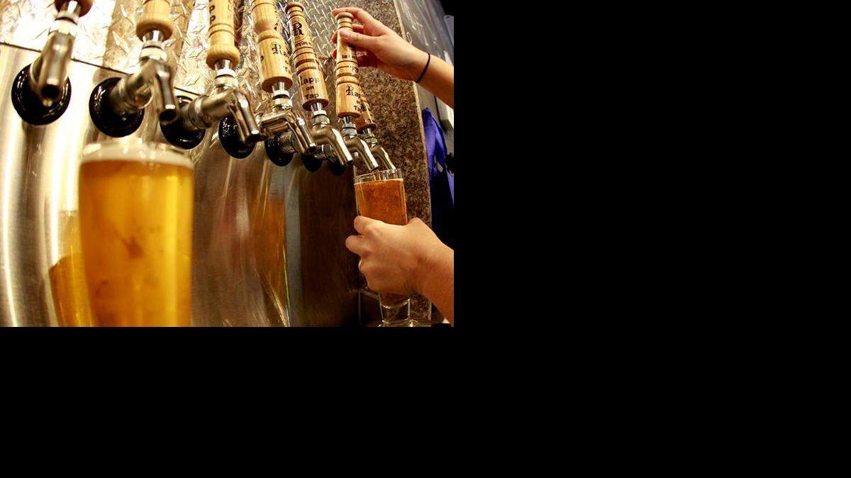 
In Seminole: Candice Moran, the tasting room manager at Rapp Brewing, pours a beer.
