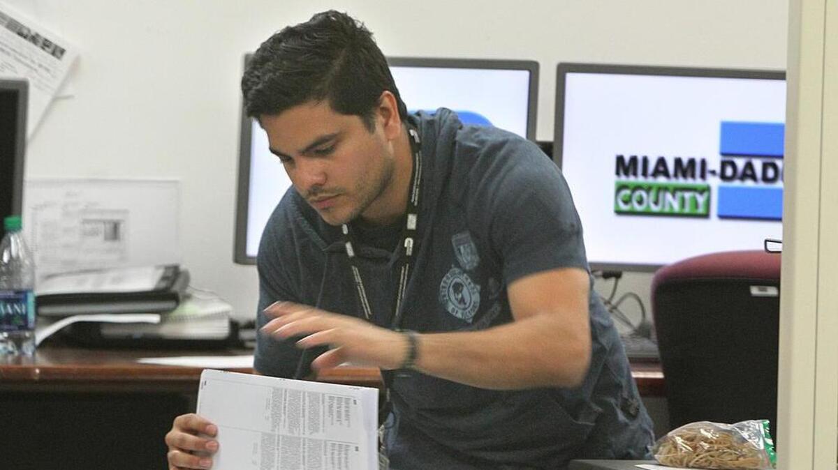 A Miami-Dade staffer in the early  hours of the machine recount in Florida’s most populous county. After six days, the county easily met the 3 p.m. Thursday deadline to recount more than 800,000 ballots.