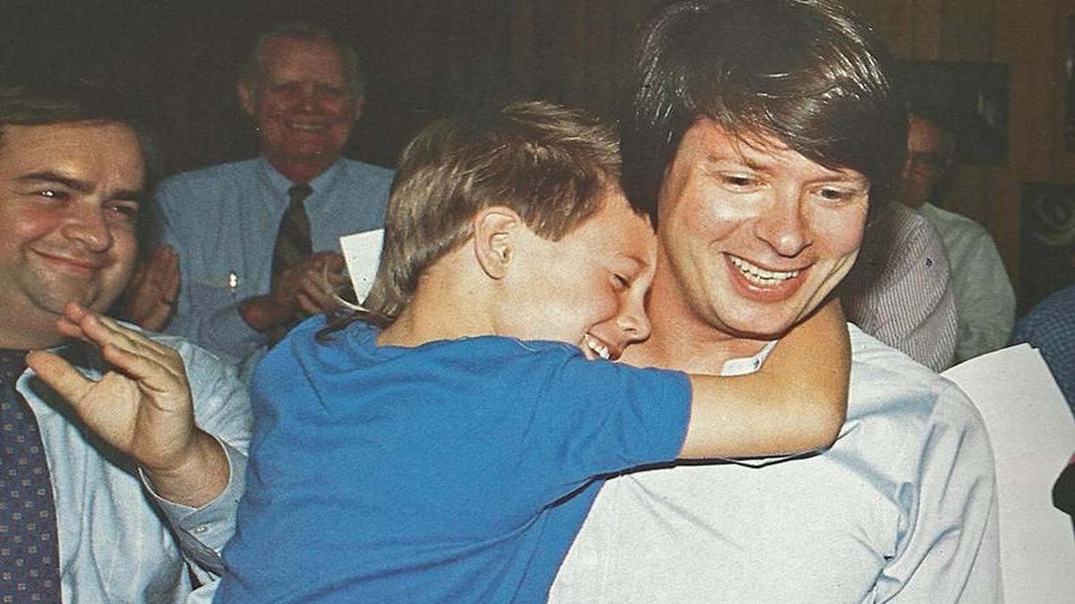A winning moment:  Dave Barry is hugged by his son, Robbie, after hearing the announcement that the humorist had won the Pulitzer Prize for Commentary. This photo was taken in the Miami Herald newsroom in April 1988.