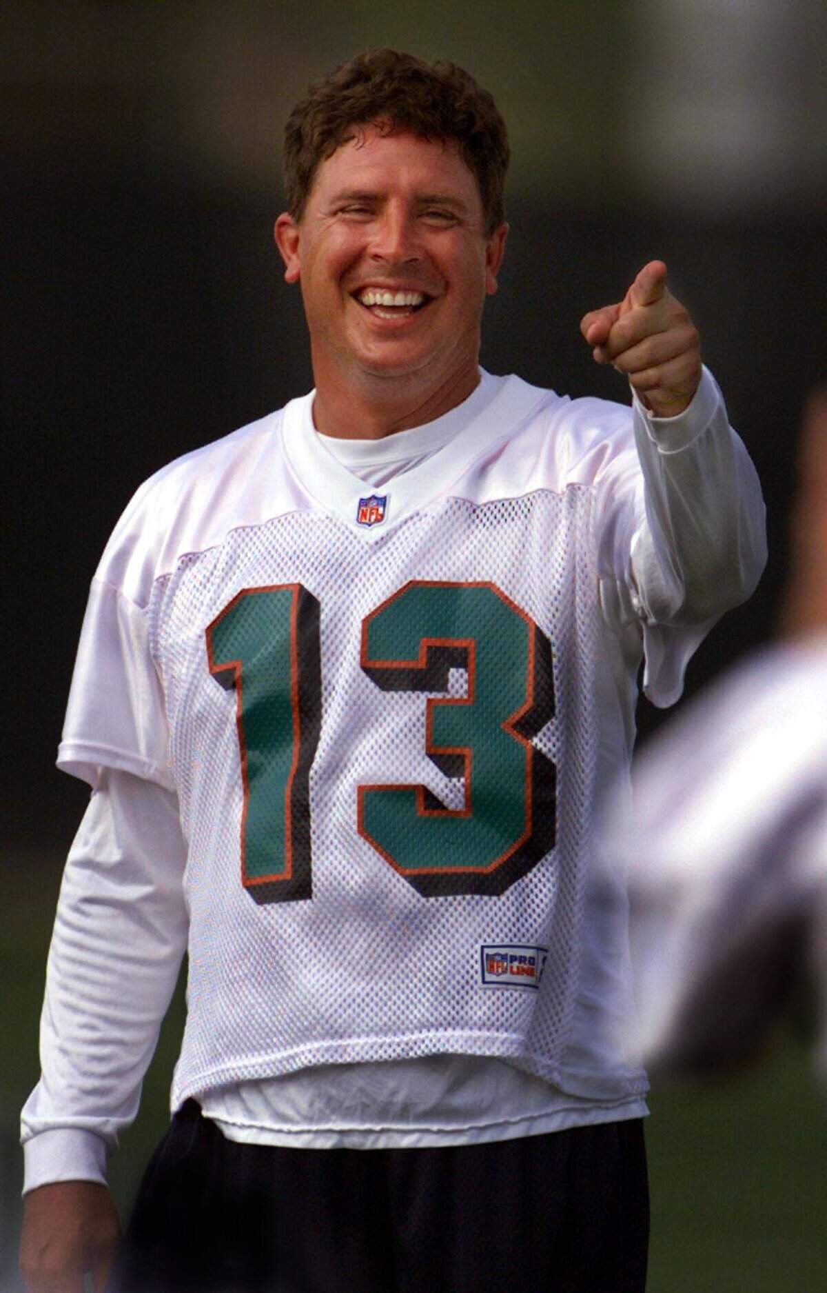 Dan Marino shares a laugh with Damon Huard.