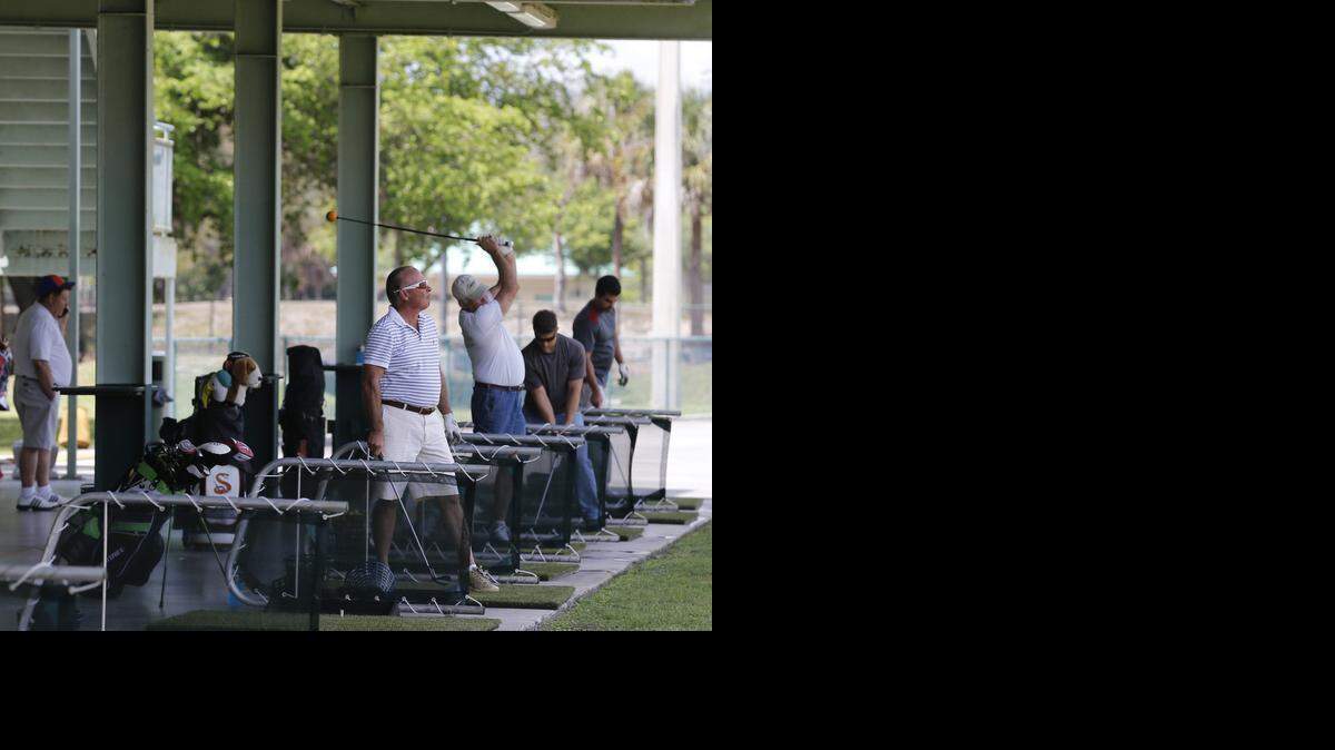 
C.B. Smith Park: Golfers take swings this week from a double-deck driving range, one of the draws of C.B. Smith Park in Pembroke Pines. 
