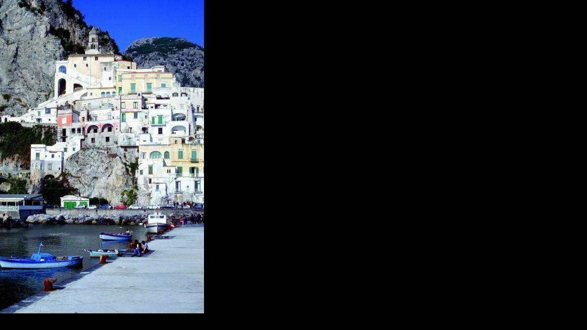 
On the Amalfi Coast of Italy, buildings climb up the hillsides from the sea.
