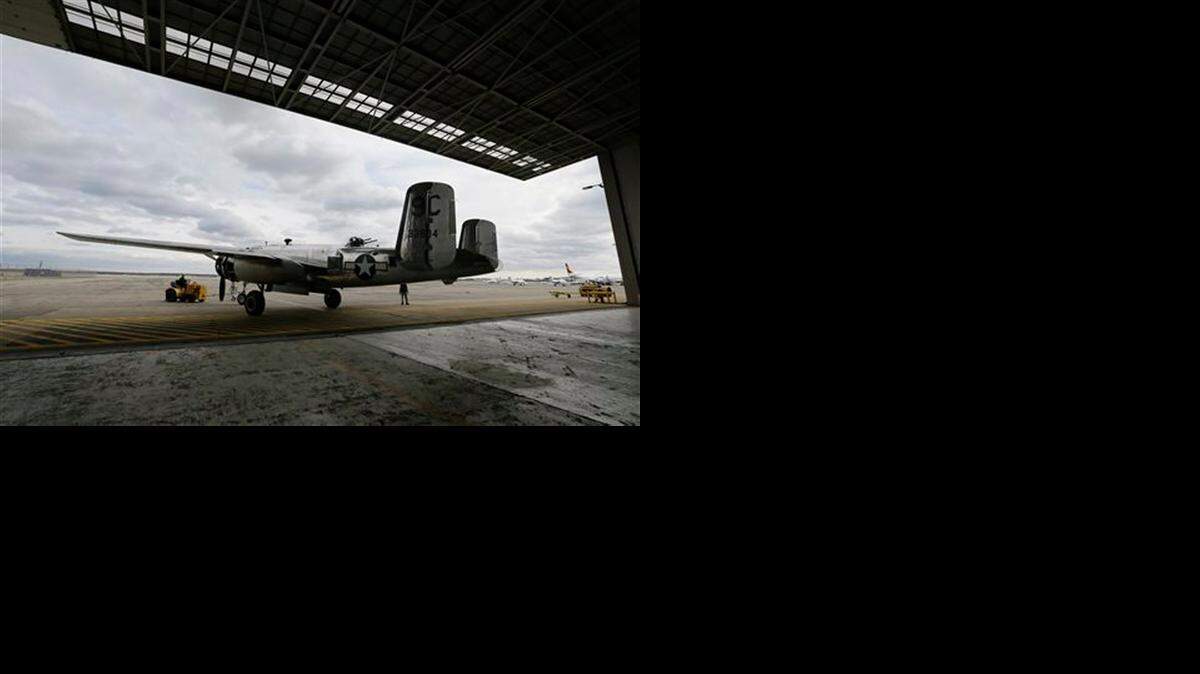
 A B-25 bomber, part of the Yankee Air Museum collection, is pulled from a hangar near the former Willow Run Bomber Plant in Ypsilanti Township, Michiga.


