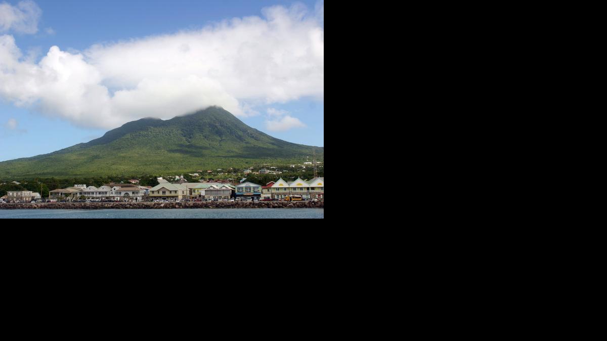 Mount Nevis, its top usually shrouded in clouds, rises above Charlestown, the only city on the island.