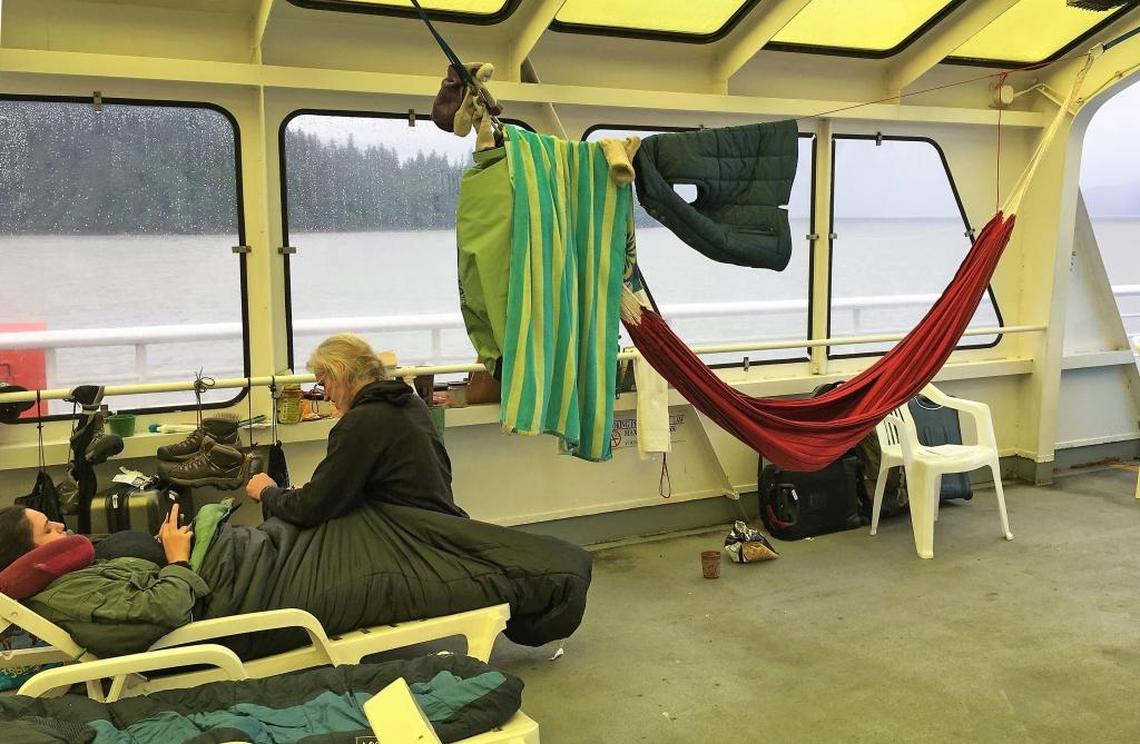 Some ferry passengers spend the night in the top deck solarium in a lawn chair or string a hammock.