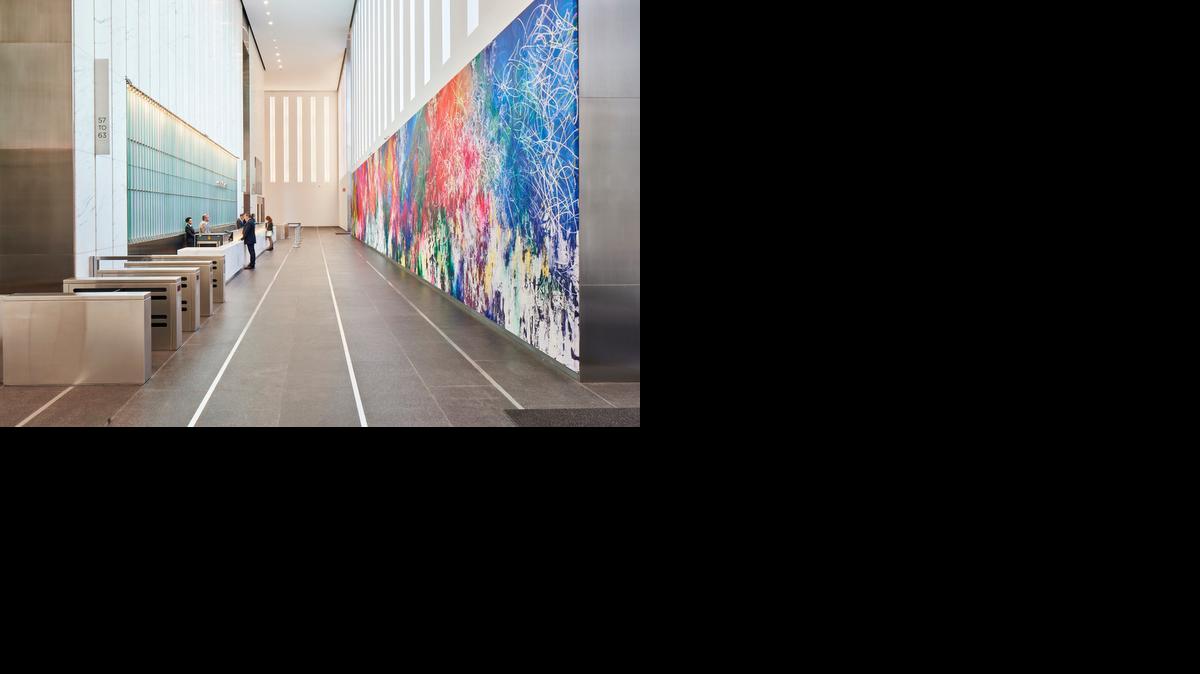 
“ONE: Union of the Senses,” a color-splashed, 90-by-15-foot painting by Jose Parla, is the largest of the 13 public artworks by five artists selected or commissioned for the new 1 World Trade Center building in New York. 
