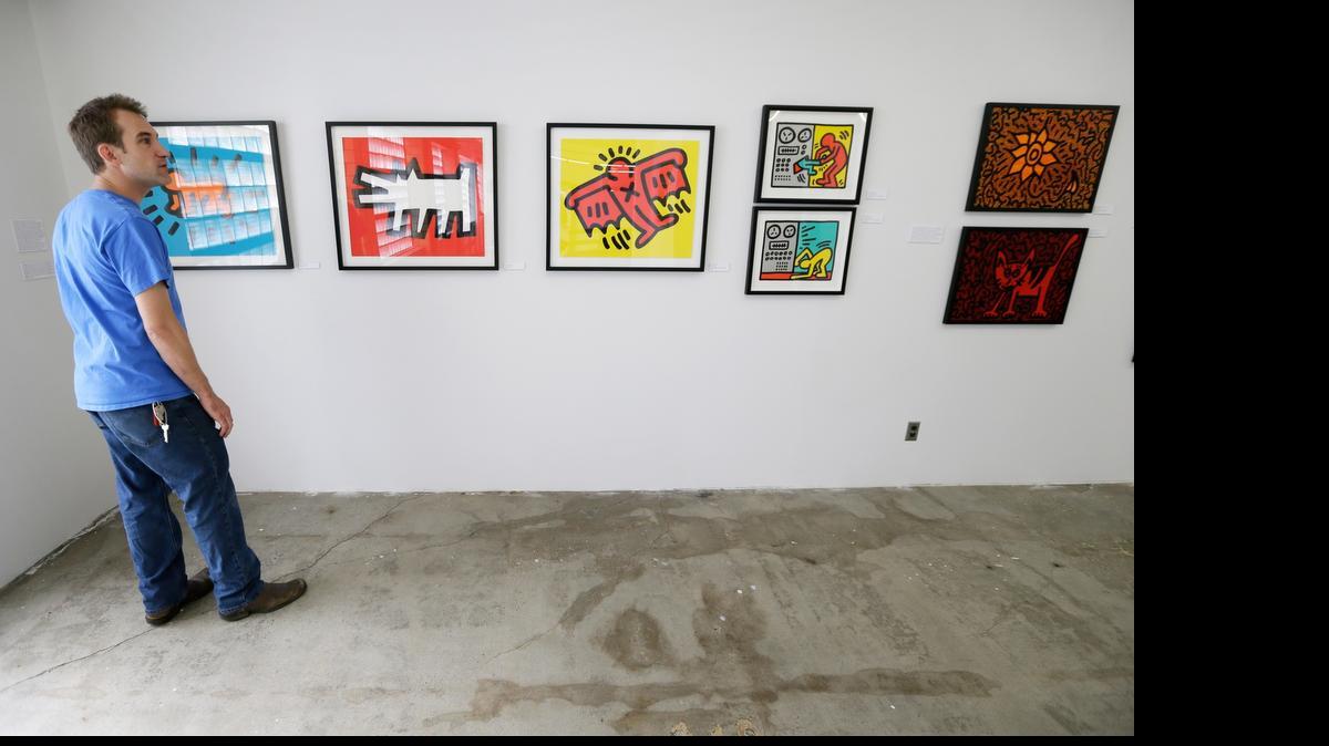 
A visitor to the Des Moines Social Club looks at art on display.
