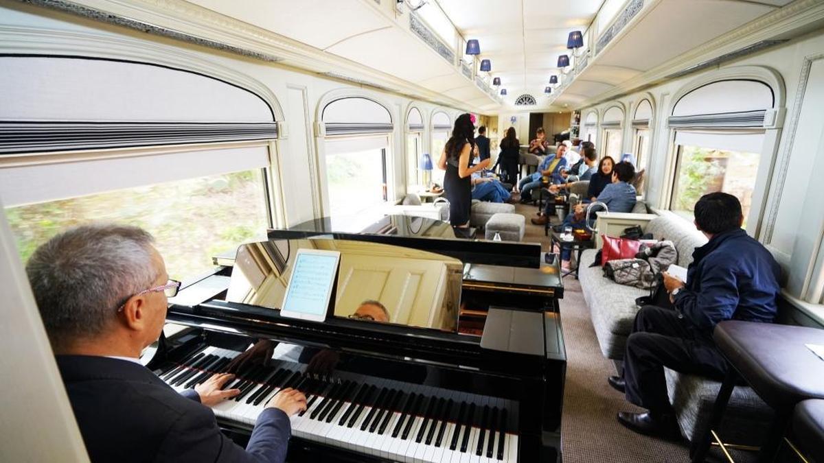 Singer Pierina Less performs a varied repertoire of music for guests in the Piano Bar Car.