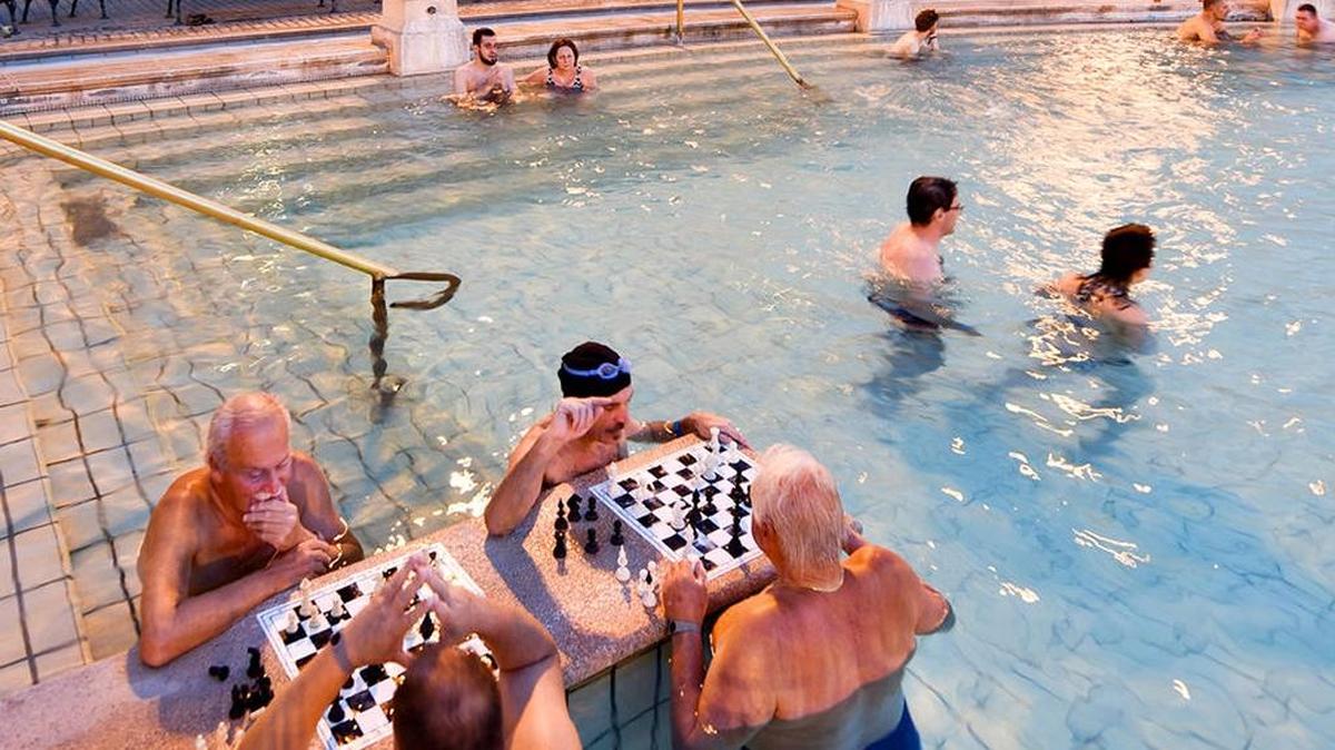 At Budapest’s Széchenyi Baths, intellectuals and elder statesmen stand in chest-high water around chessboards and ponder their next moves.
