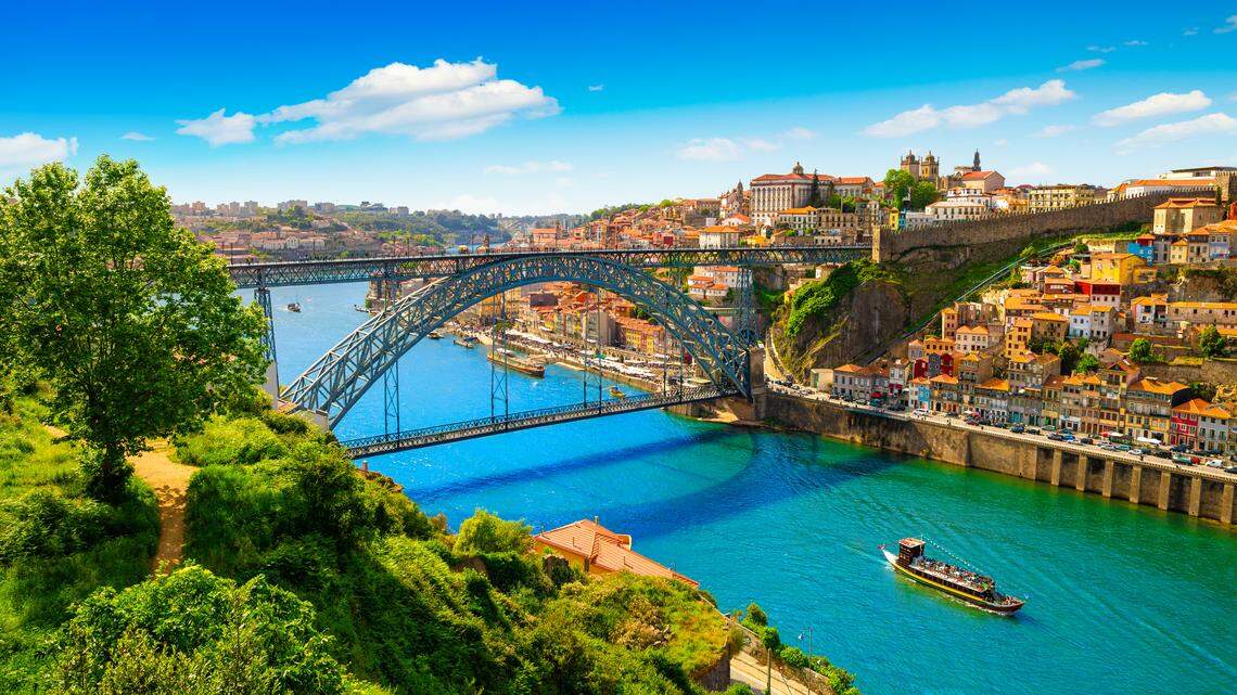 Porto’s terracotta rooftops and the winding Douro River make for one of Europe’s most photogenic spring backdrops.