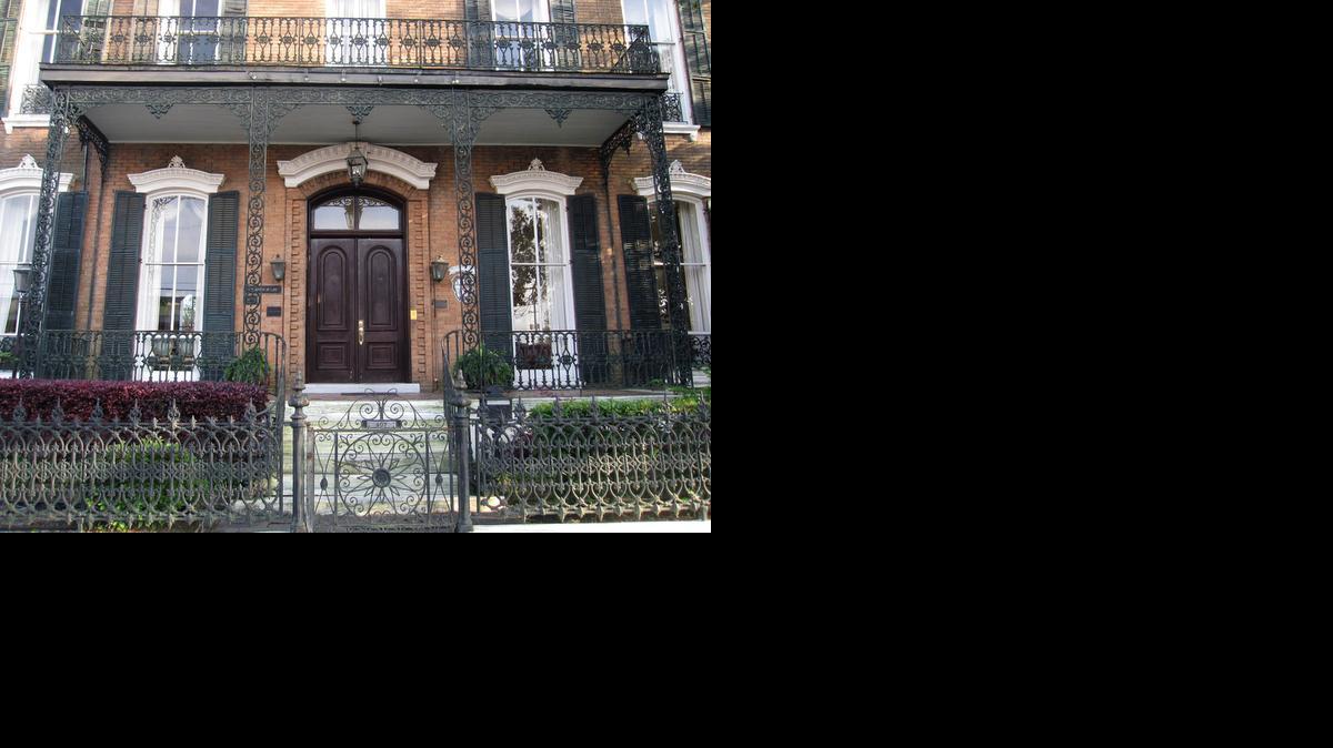 
Mobile’s downtown streets are lined with homes and businesses decorated with the picturesque lacy-patterned ironwork like this.
