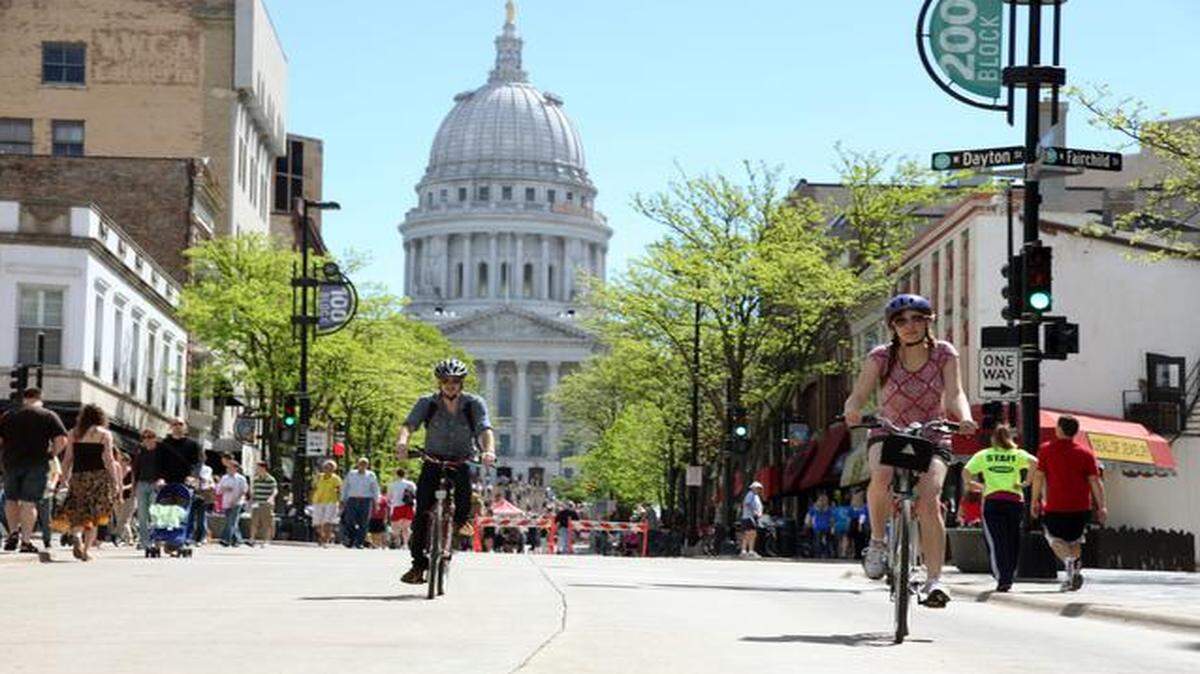 
State Street runs about three-quarters of a mile from the state Capitol to the University of Wisconsin campus. The thoroughfare is car-free except for delivery trucks and buses, attracting a mix of undergrads, locals and government workers for shopping, dining and people-watching. 

