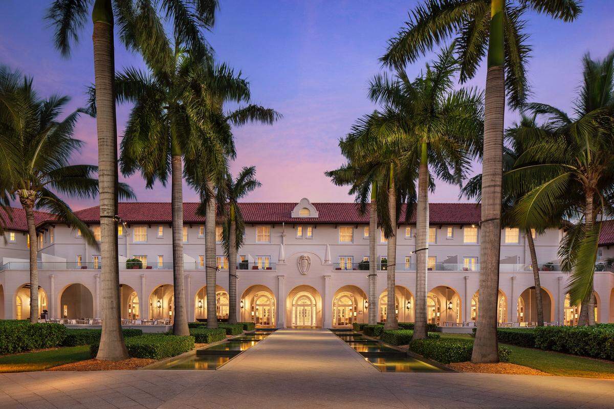 The exterior of the Casa Marina Resort aglow at sunset.