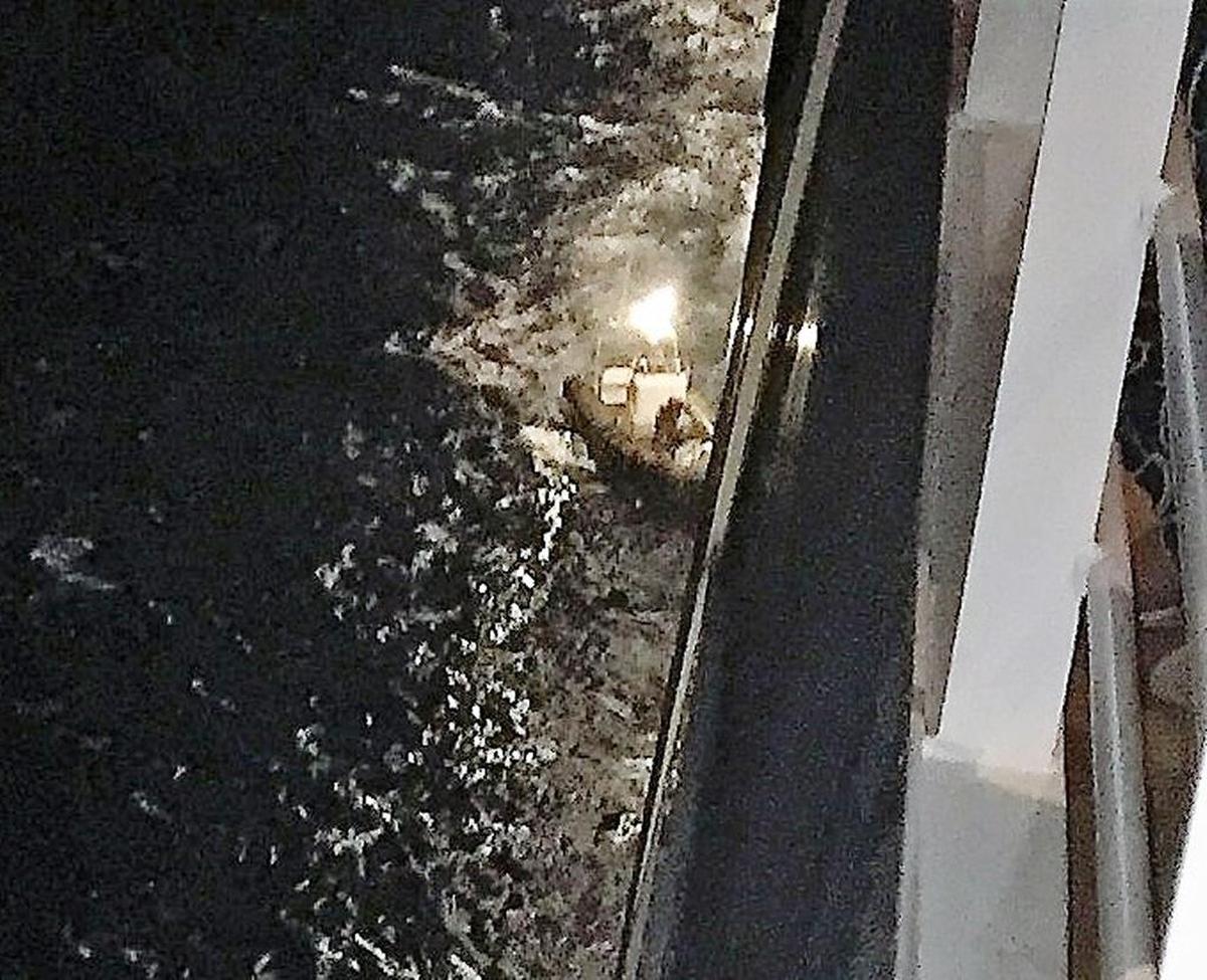 At night, a small boat delivers extra security to Seabourn Encore in the Red Sea, for its passage through the pirate-infested Gulf of Aden.