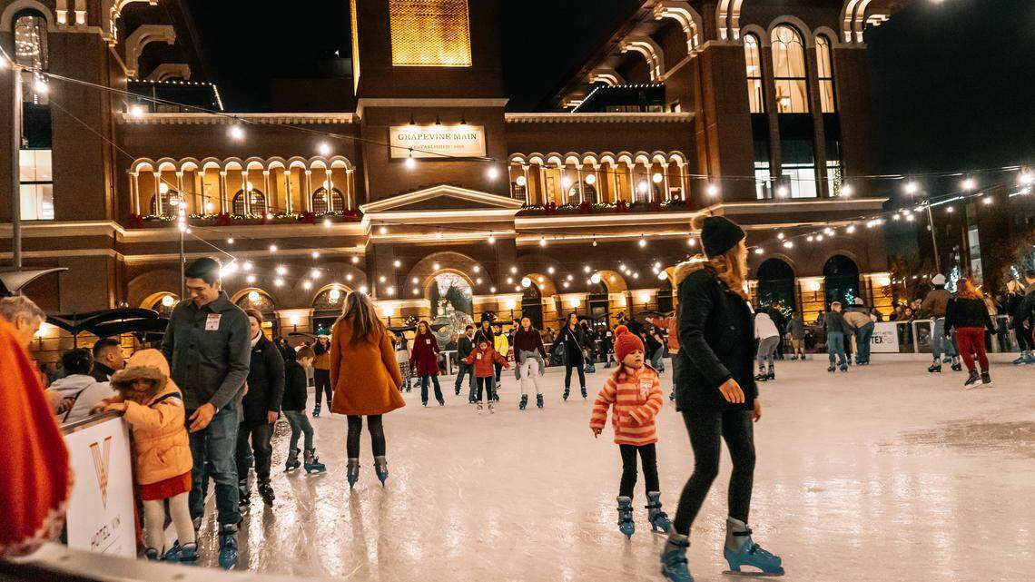 Skaters enjoy a winter night at the Grapevine Main ice rink.