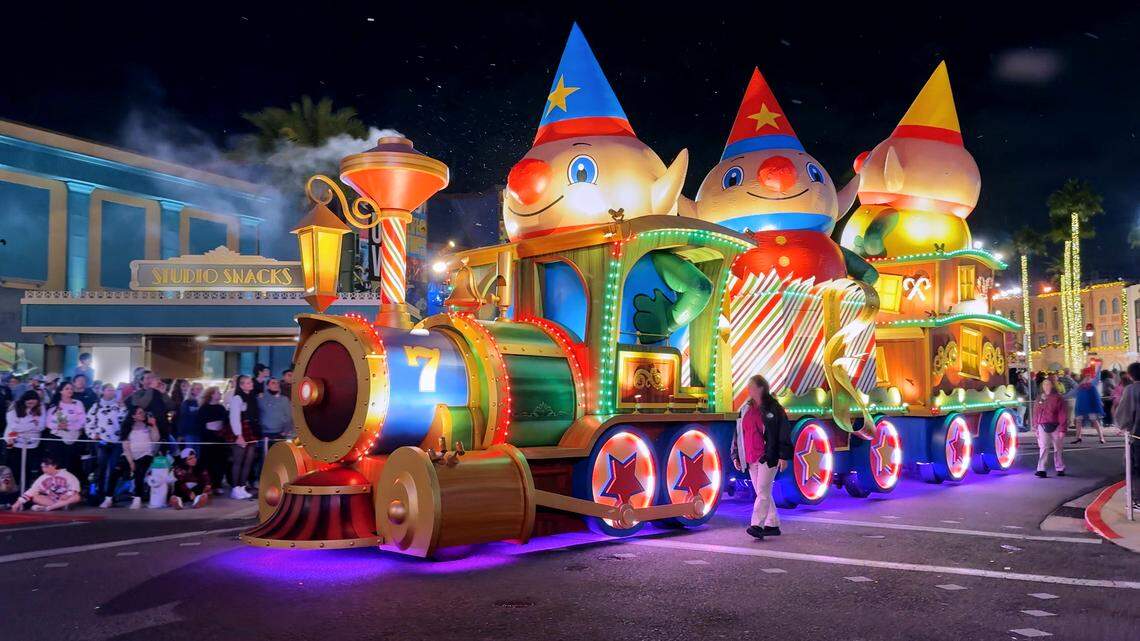 A colorful holiday parade brings lively floats and bright lights to Orlando’s theme parks.