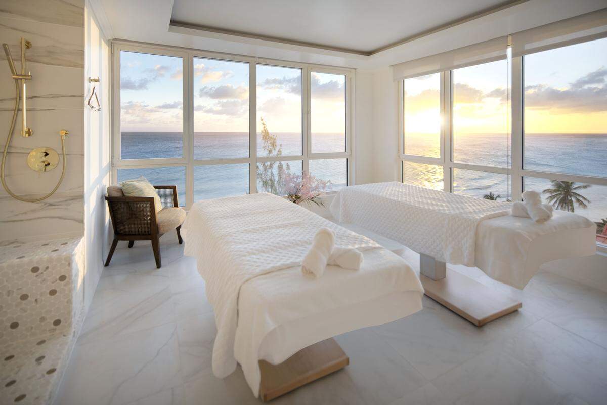 A serene treatment room at Acqua Spa inside O2 Beach Club & Spa, where ocean views set the tone for relaxation.