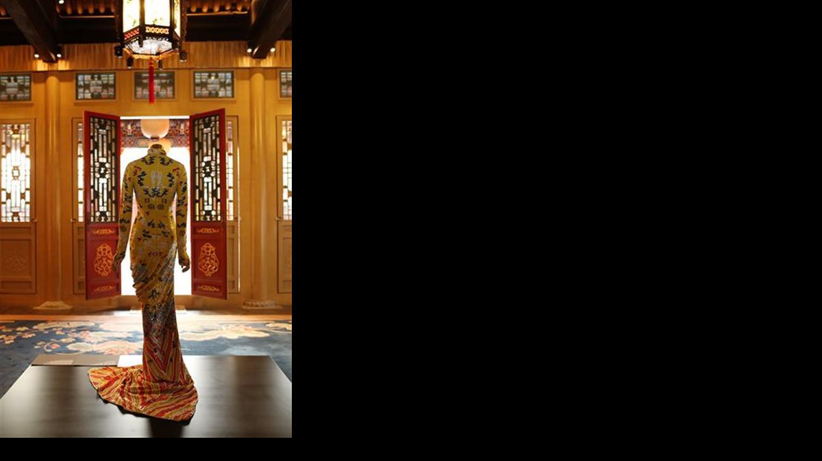 
In this image from the Costume Institute, a gown is displayed in Beijing. 

