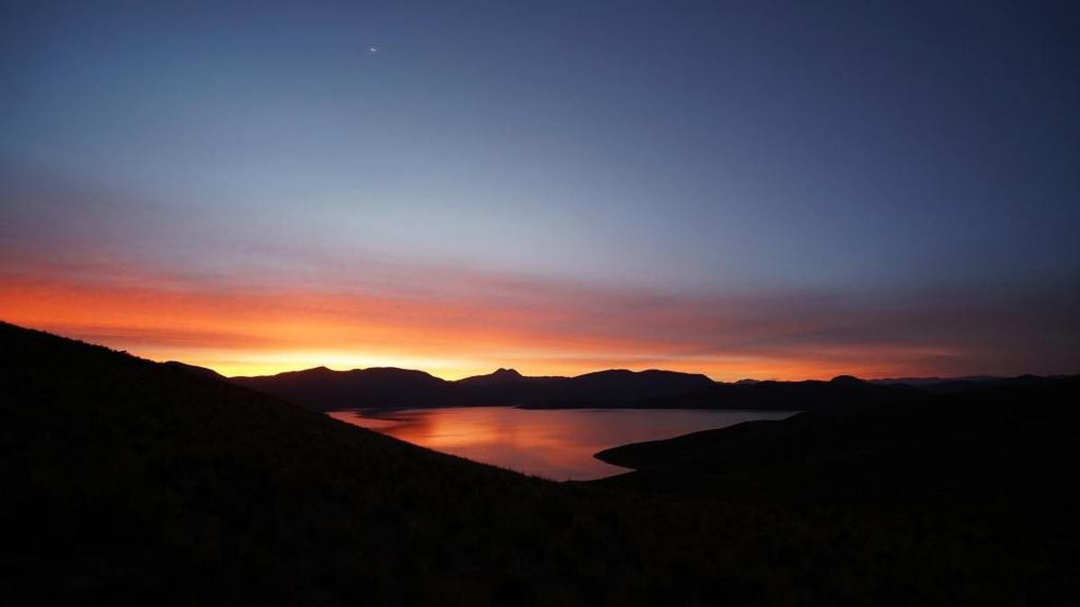 Breathtaking view of Lake Saracocha at dawn, located at 13,566 feet above sea level.