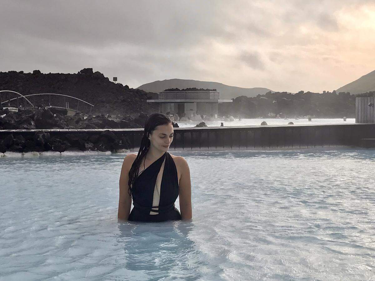 The milky-blue geothermal waters of Iceland’s Blue Lagoon are mesmerizing against a stark volcanic landscape.