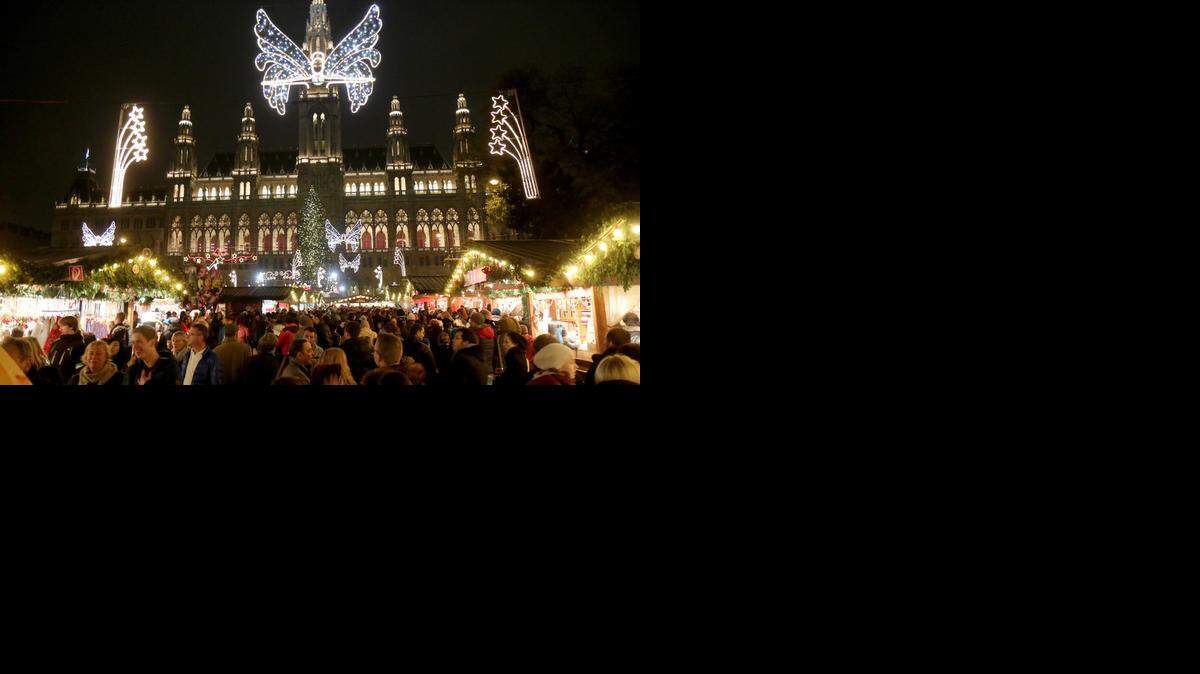 
Visitors crowed the Christmas market in front of the neo-Gothic City hall in Vienna, Austria. Among the hundreds of goods on offer are tree lights, candles, ornaments and musical Christmas toys. 
