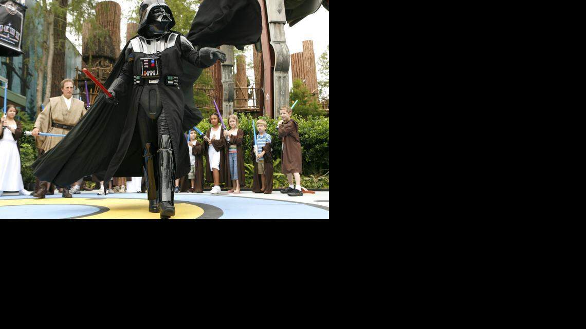 
Darth Vader makes a dramatic entrance to Jedi Training Academy during Star Wars Weekends at Disney's Hollywood Studios, where the closing of two rides has prompted speculation that more Star Wars attractions are planned for the theme park.
