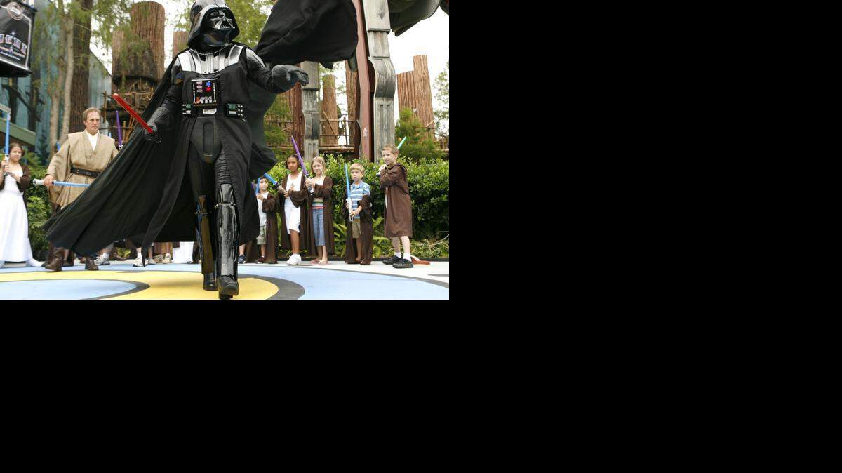 
Darth Vader makes a dramatic entrance to Jedi Training Academy during Star Wars Weekends at Disney's Hollywood Studios, where the closing of two rides has prompted speculation that more Star Wars attractions are planned for the theme park.
